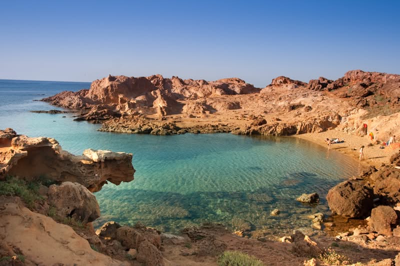 spain-balearic-islands-menorca-minorca-cala-pregonda-beach-gettyimages-163190189.jpg