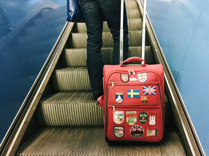 Suitcase with patches on it