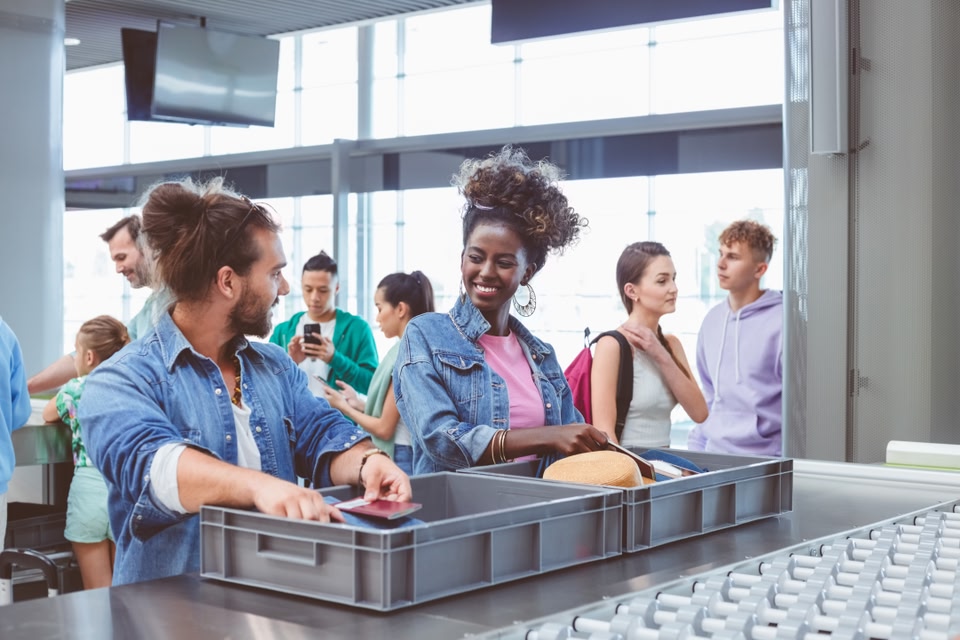 Two people going through airport security