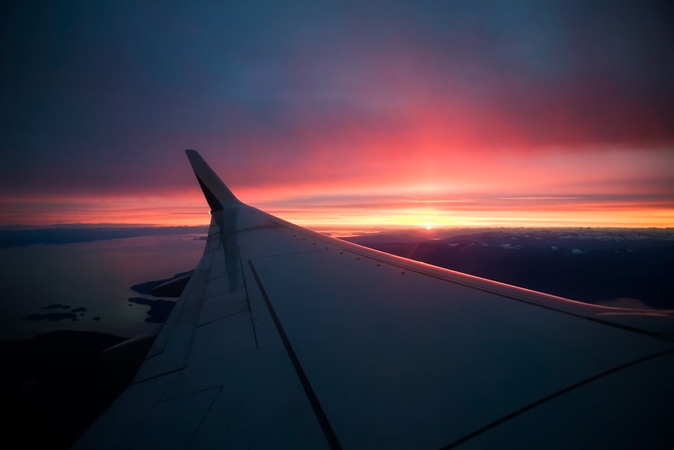 A plane wing at sunset