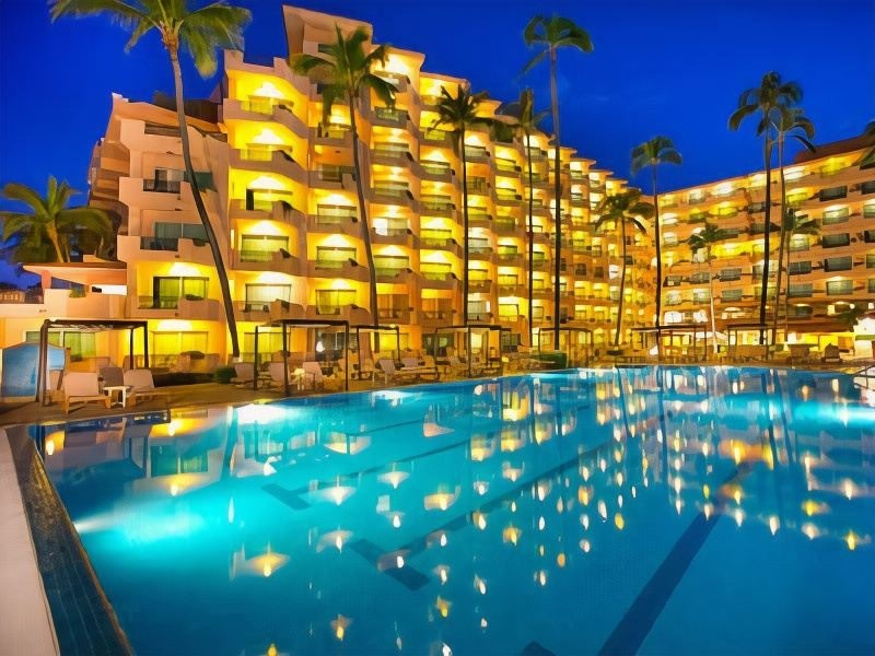The serene pool area at Crown Paradise Golden Puerto Vallarta, an adults-only resort.