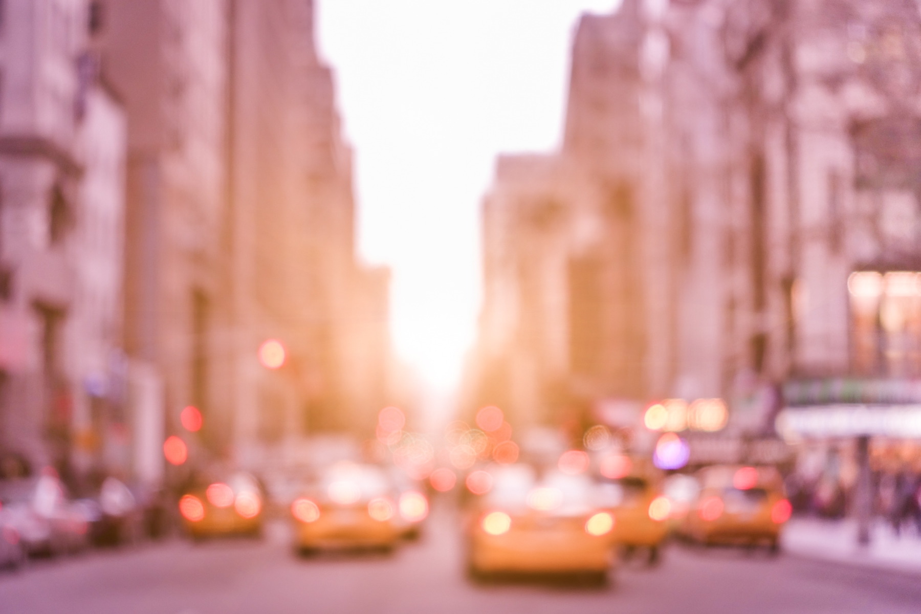 Out-of-focus taxis on street in New York City