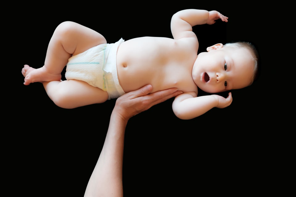 Baby lifted above head