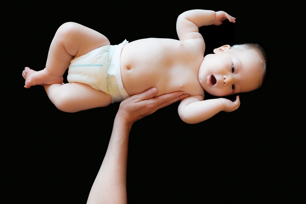 Baby lifted above head