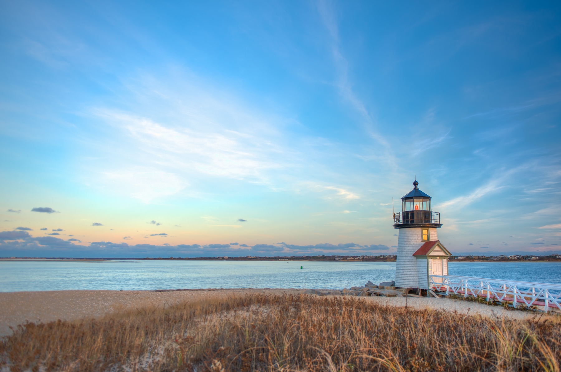 Lone lighthouse standing on the beach on Cape Cod