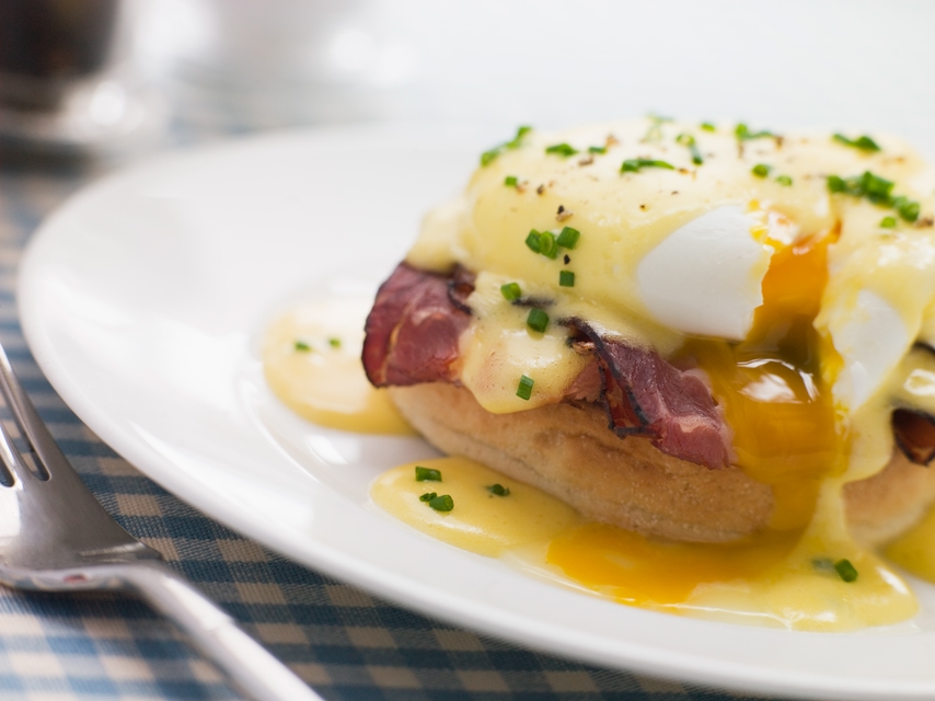 Brunch - poached eggs and bacon topped on an english muffin