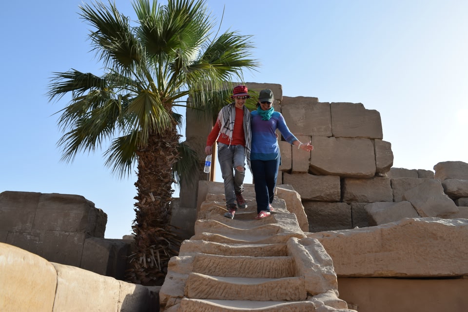 Alyson of World Travel Family walking down steep stairs