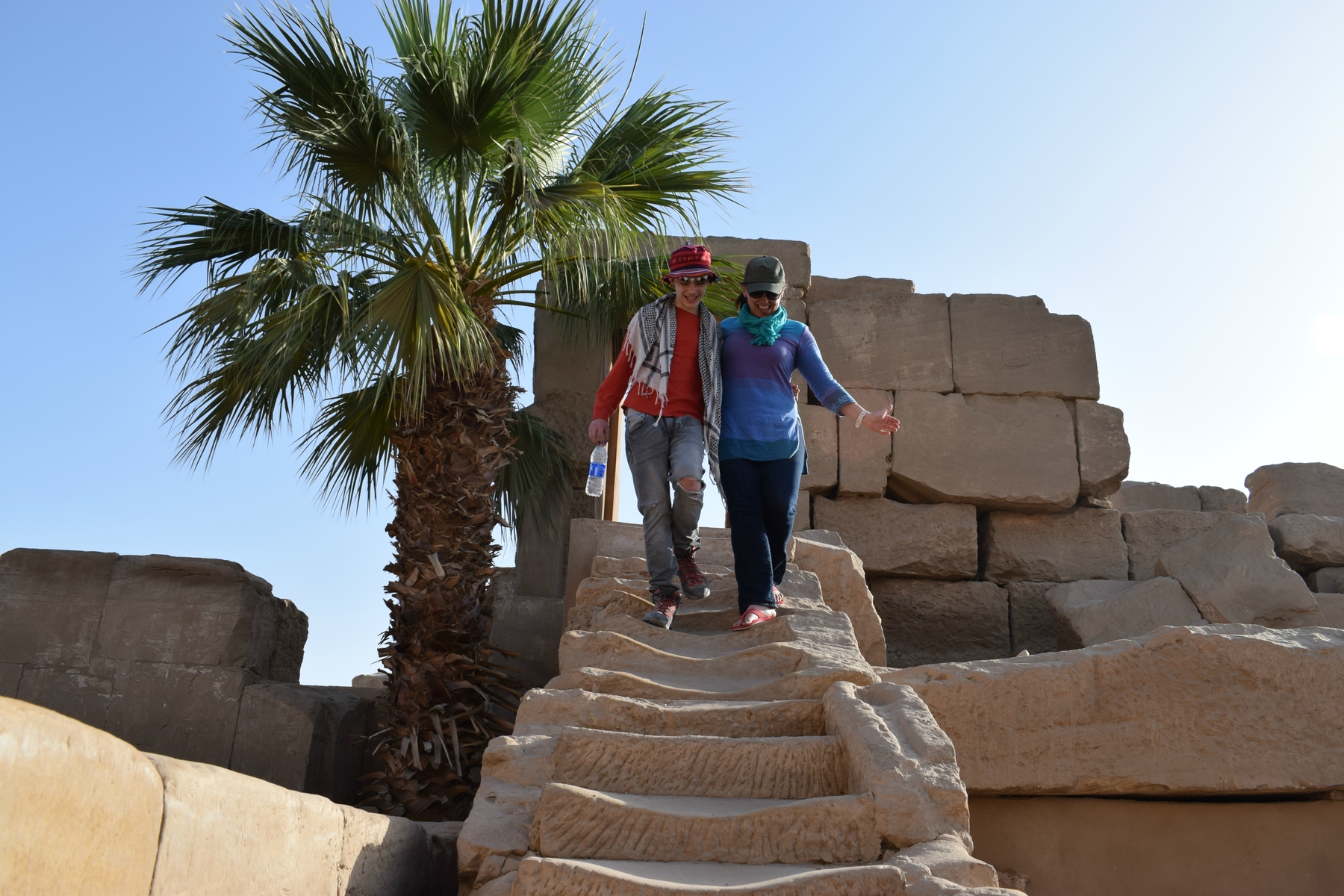 Alyson of World Travel Family walking down steep stairs