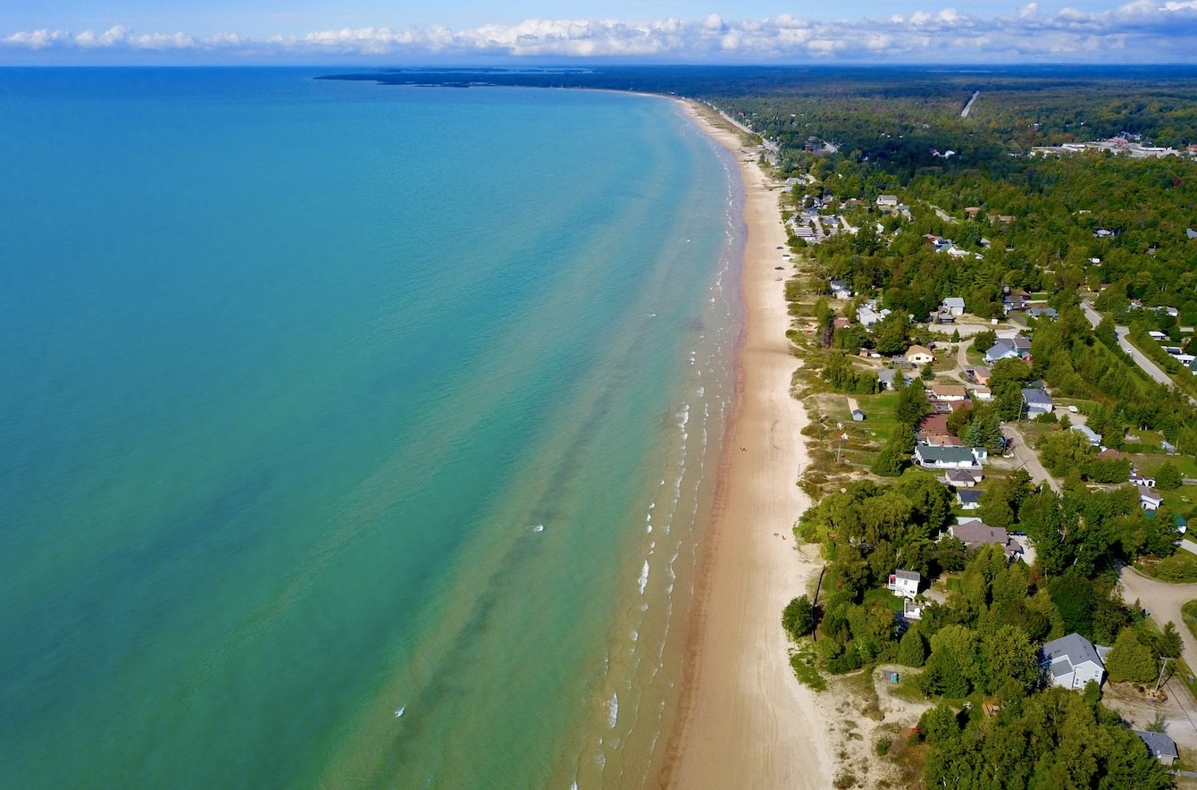 bird's eye view of sandy Sauble Beach in Toronto, turquoise blue waters. 