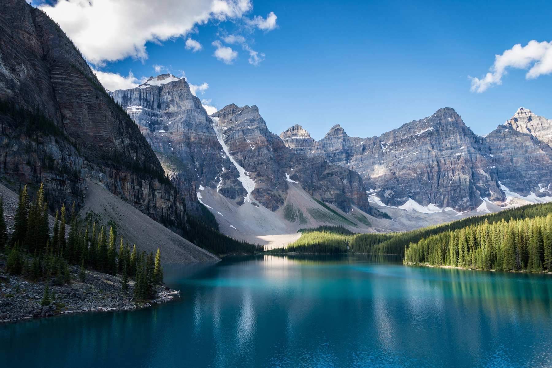 a crystal blue lake surrounded by mountains in Banff, Alberta