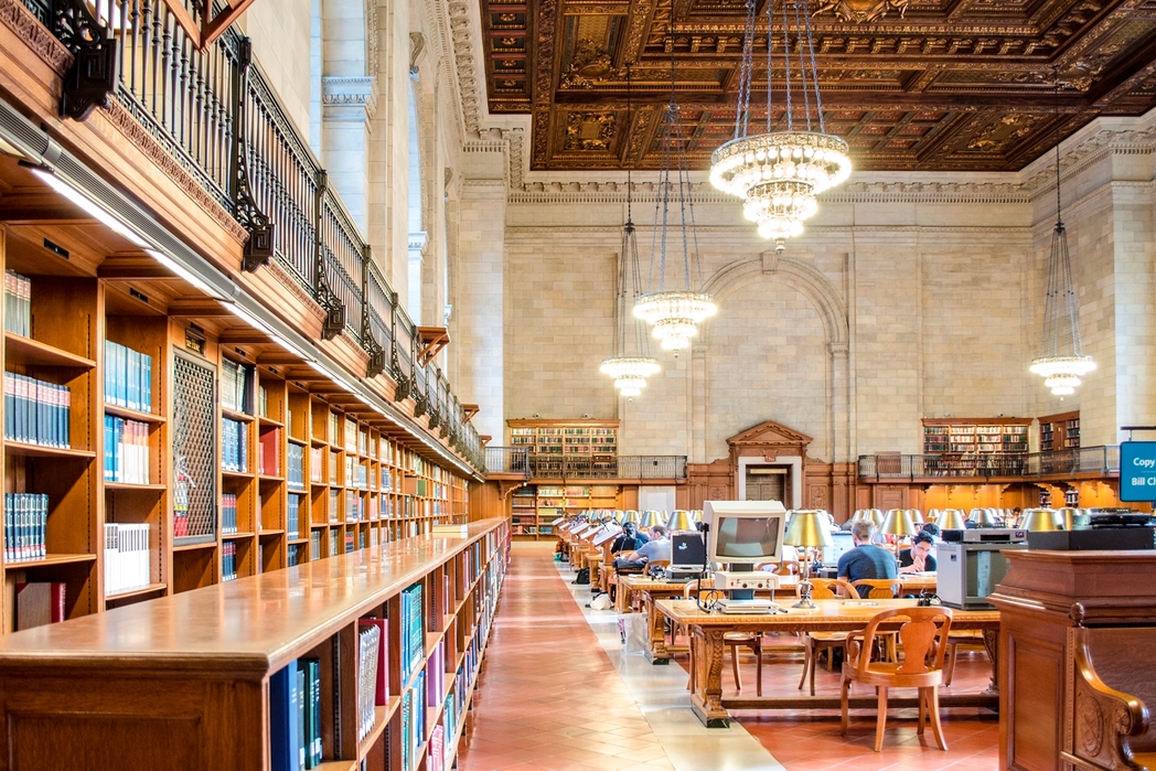 people enjoying the reading room in the New York Public Library