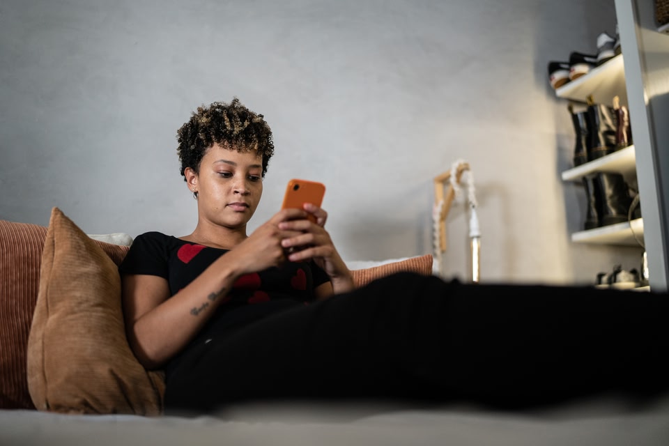 A traveler uses a mobile phone to research travel options