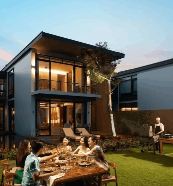 A group of friends relaxing in the garden of their Hyatt Regency Da Nang apartment