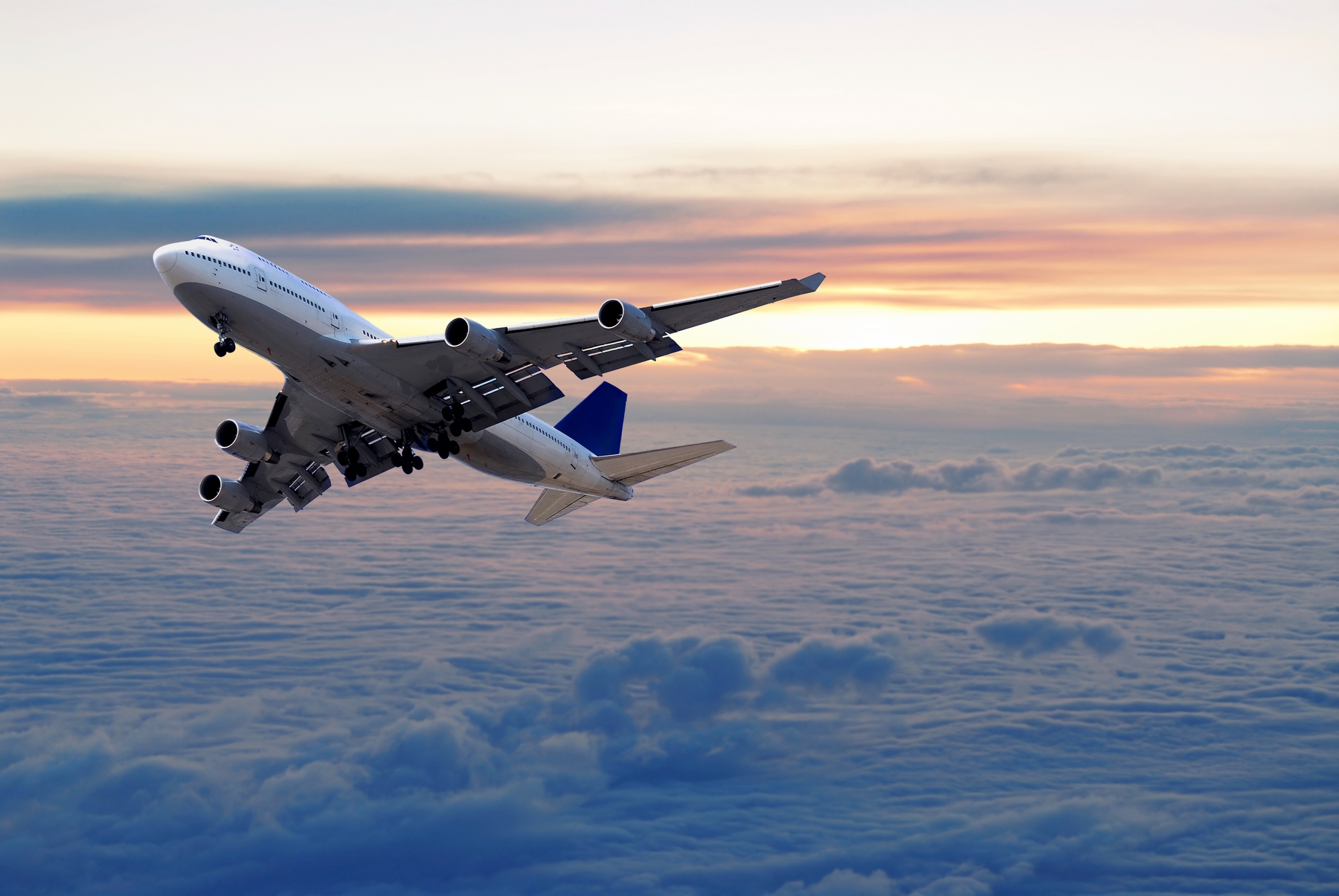 Aeroplan taking off at sunset