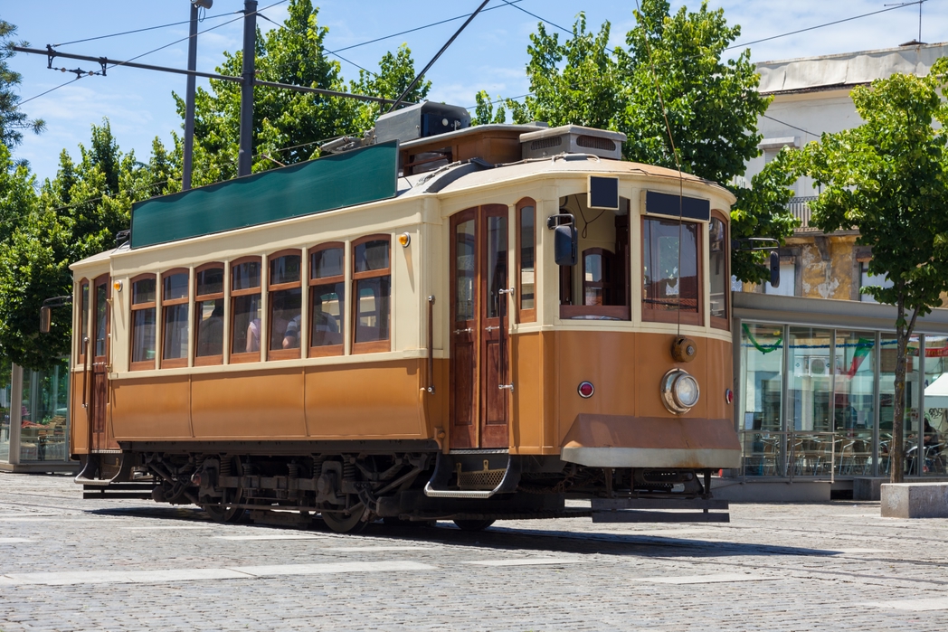 Riding the yellow old trams are one of the best things to do in Porto, Portugal
