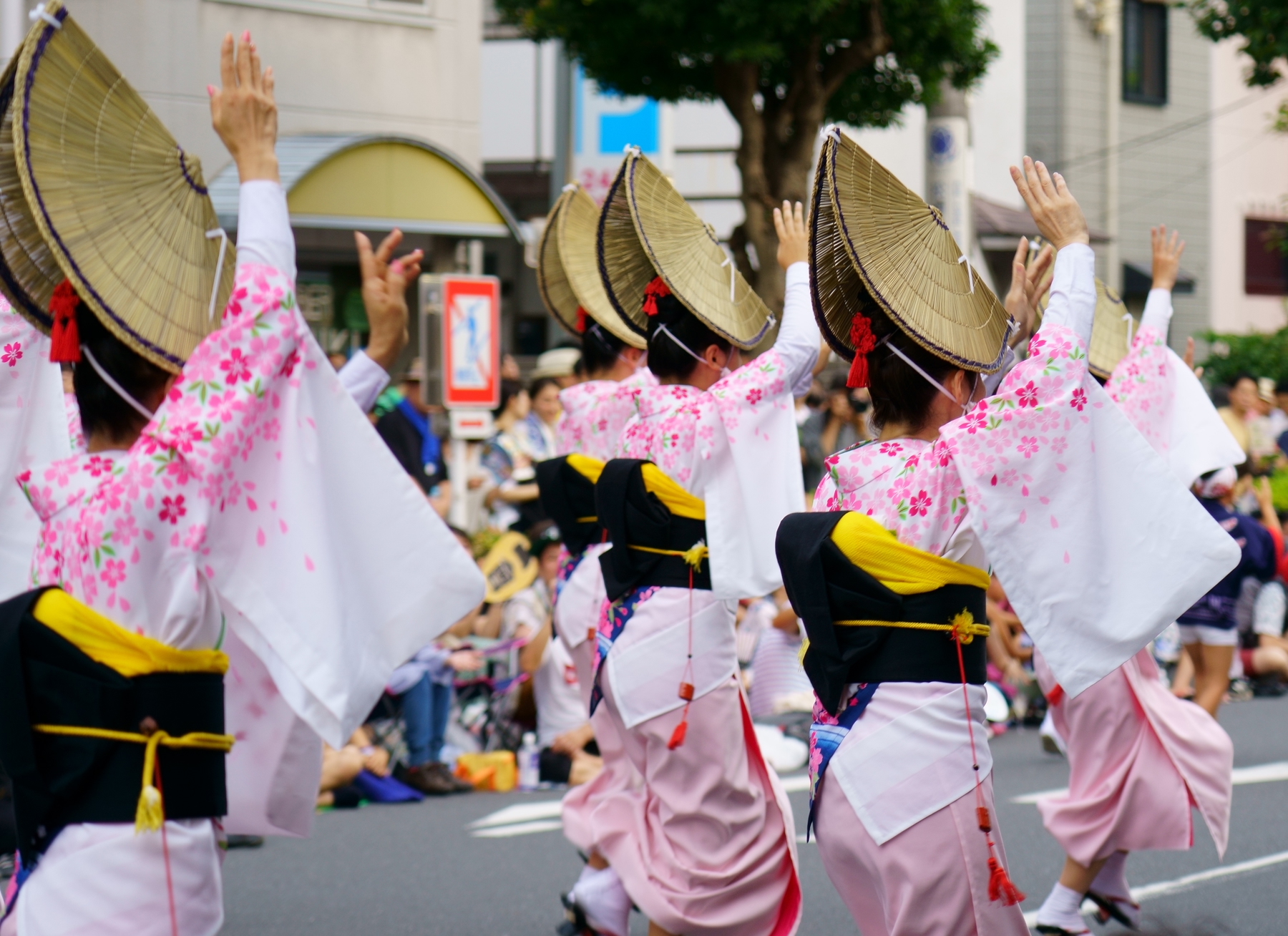 Female dancers in the street during Awa Odori Dance Festival in Japan.