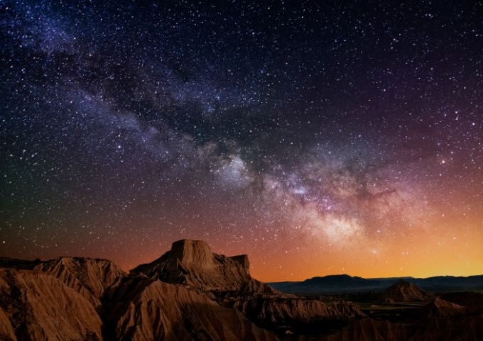 Stars over rocky butte in Chile