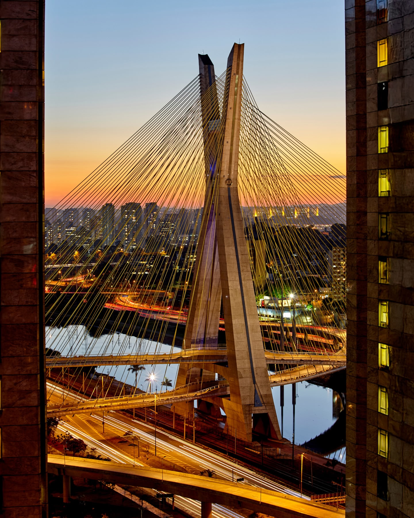 View of Octávio Frias de Oliveira Bridge through buildings in Sao Paulo Brazil