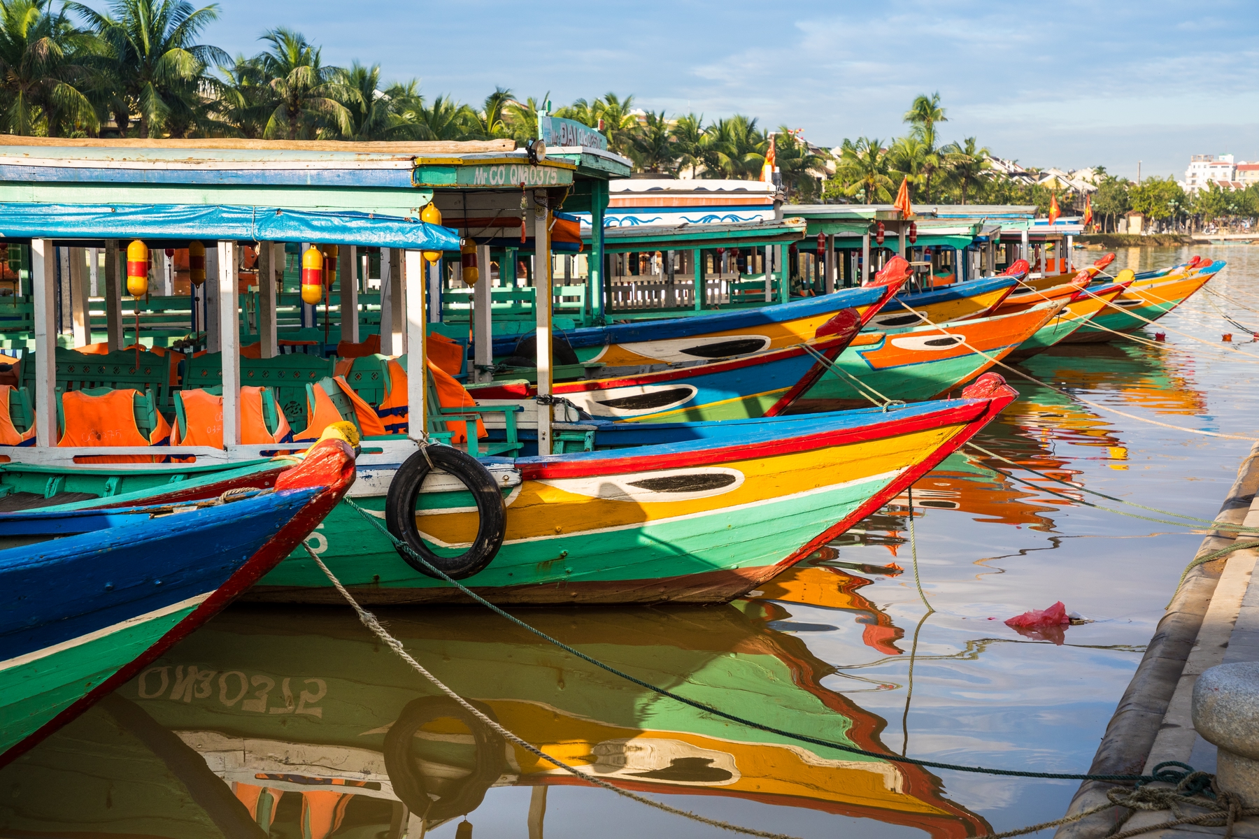 Colourful boats lined up in the harbour at Hoi An, Vietnam