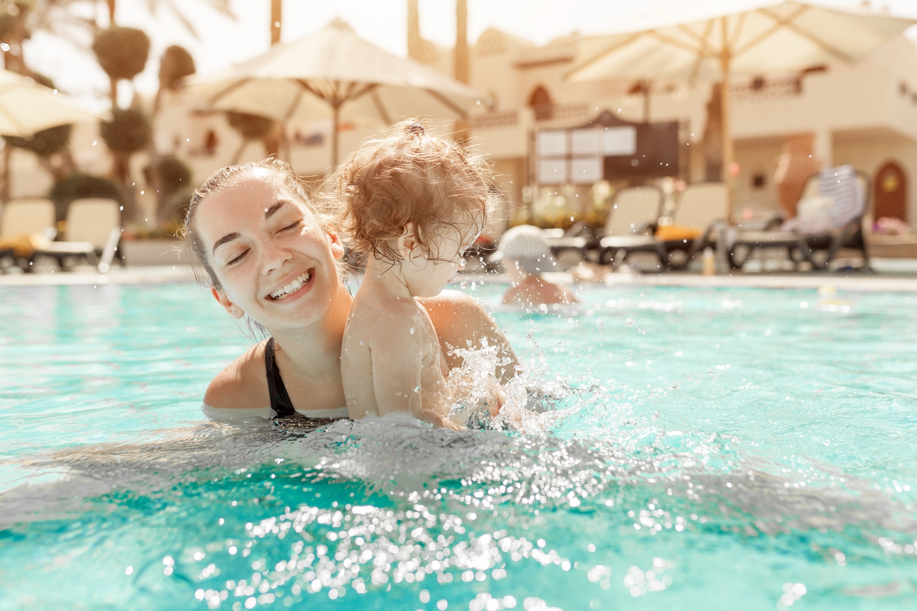 Mother and toddler in a swimming pool