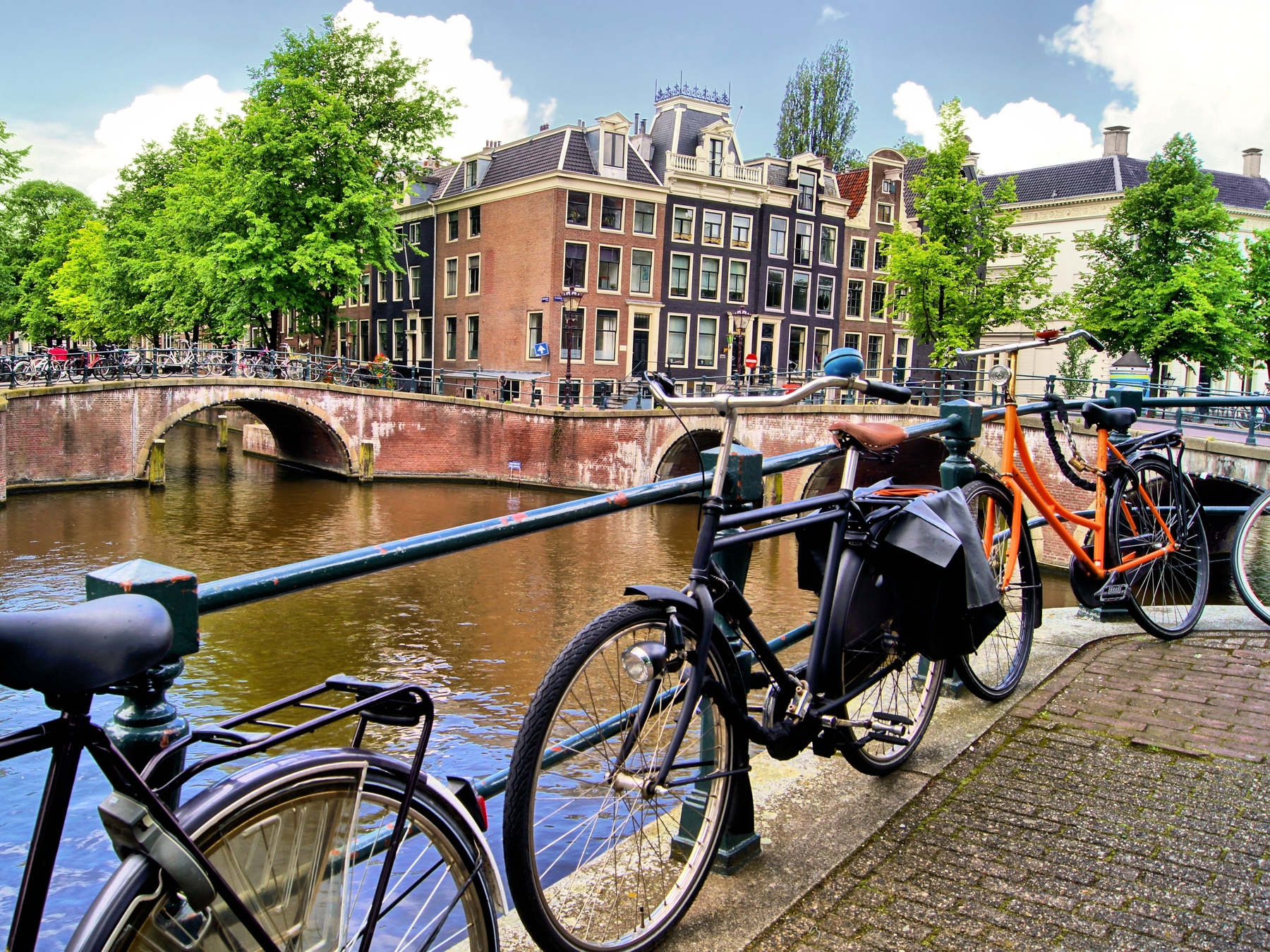 Explore the canals of Amsterdam by bike, great for city breaks for families