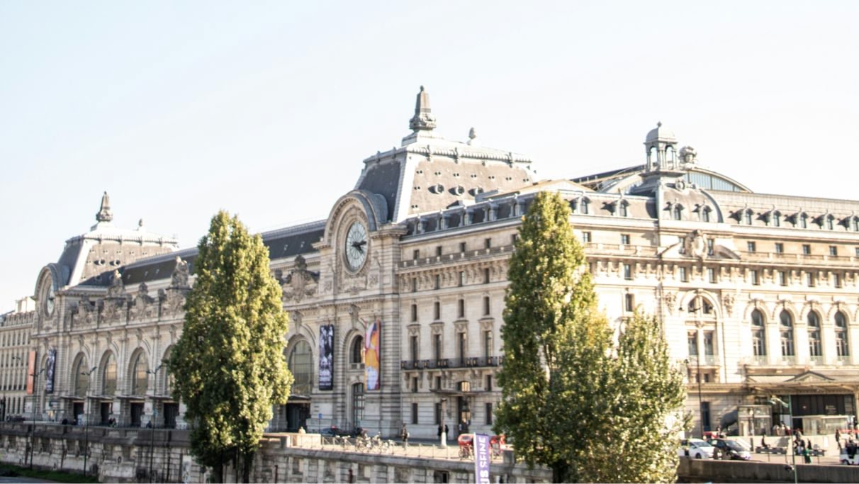 An image of a white and grey building during day time