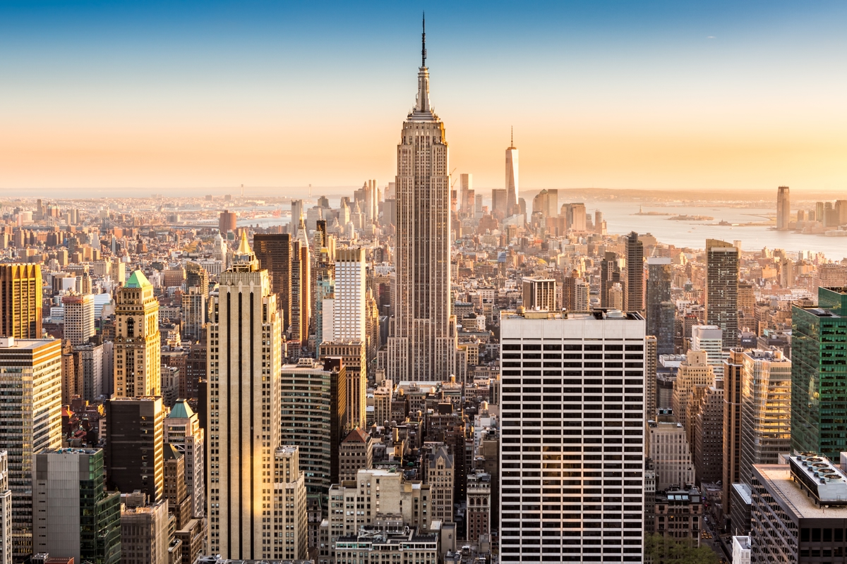An aerial shot of New York City with Skyscrapers and the Empire State Building.