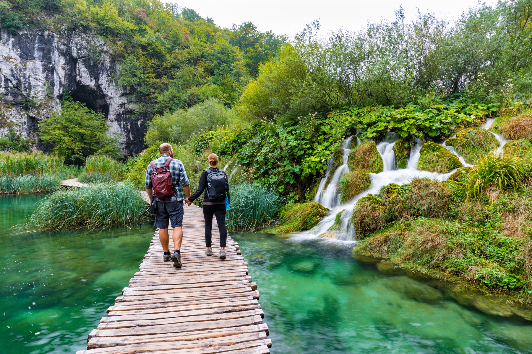 A couple hikes Plitvice Lakes National Park in Croatia.