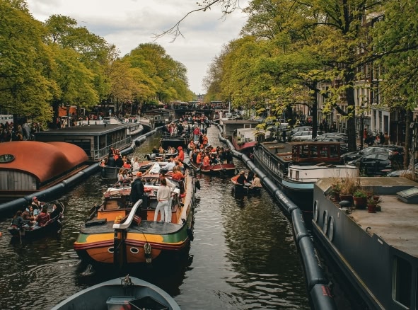 Canals lined up during Grachtenfestival festival in Amsterdam.