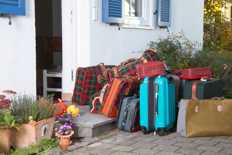 Luggage in front of a house