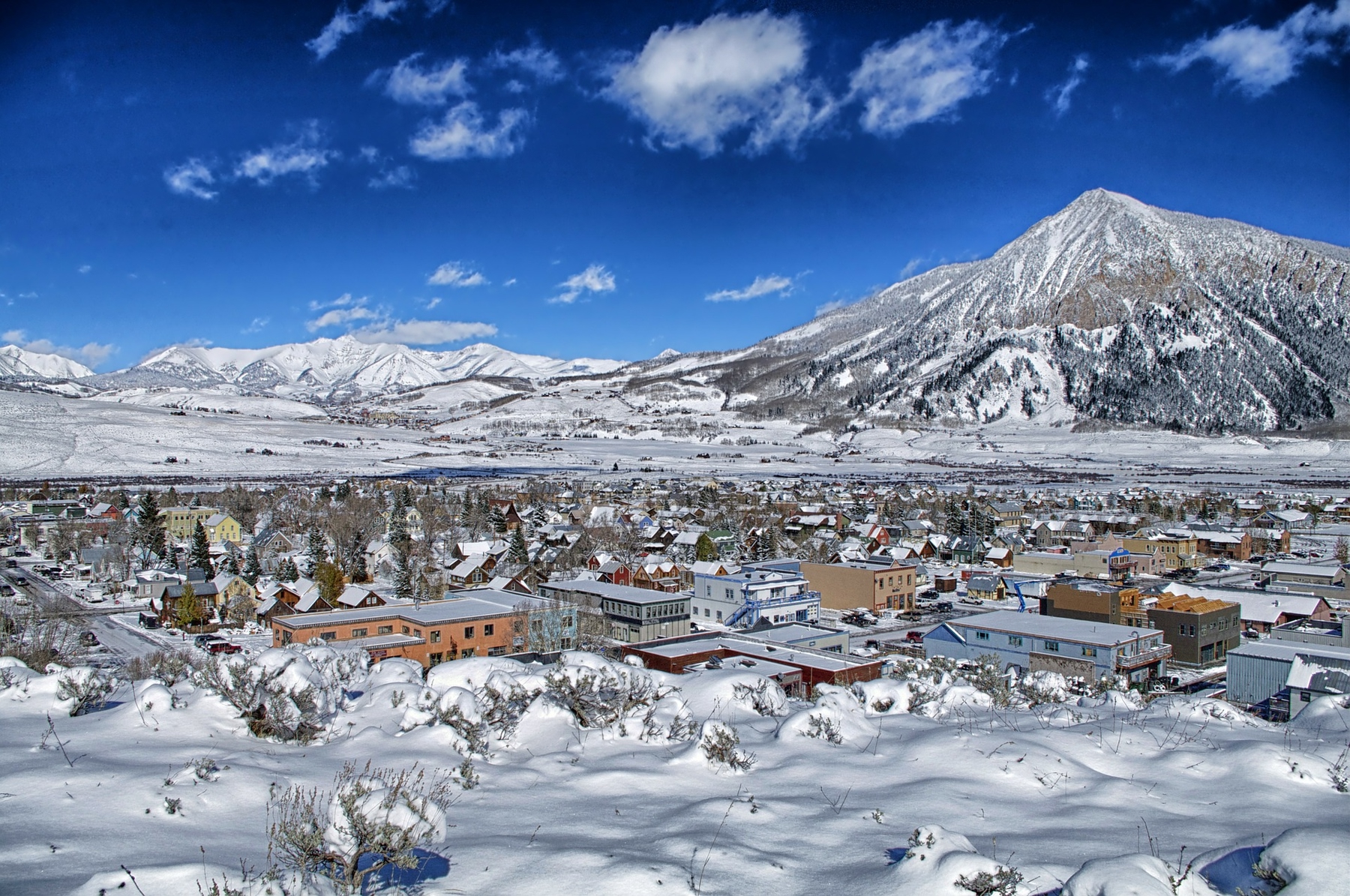 Colorado's Crested Butte town covered in snow with Crested Butte Mountain in the background.