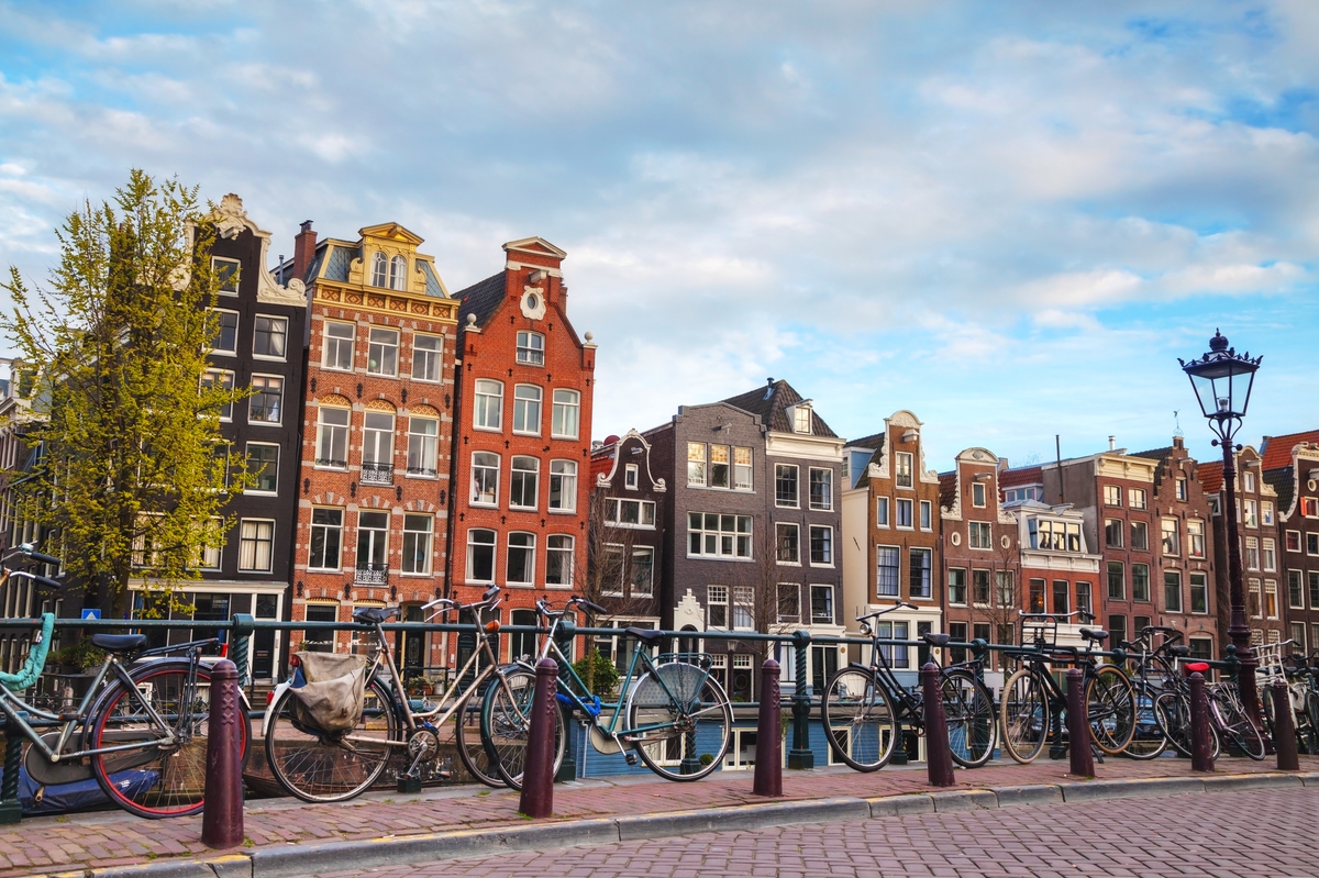 Colourful houses and bicycles along the canal in Amsterdam.