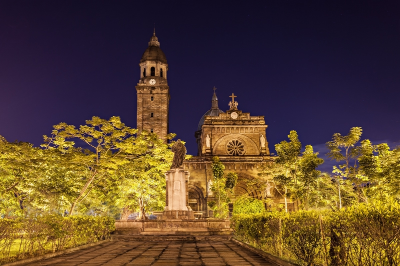 Spanish colonial building lit up after dark