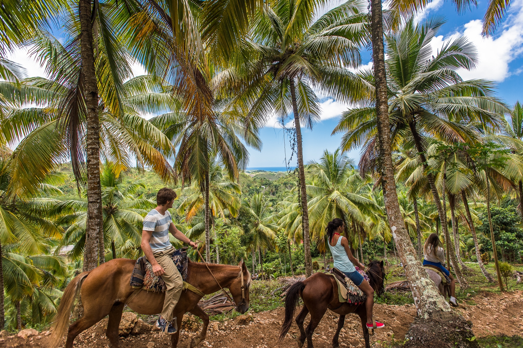 two people horseback riding in dominican republic in January