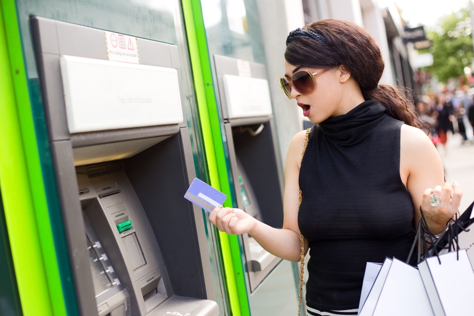 Woman using an ATM abroad