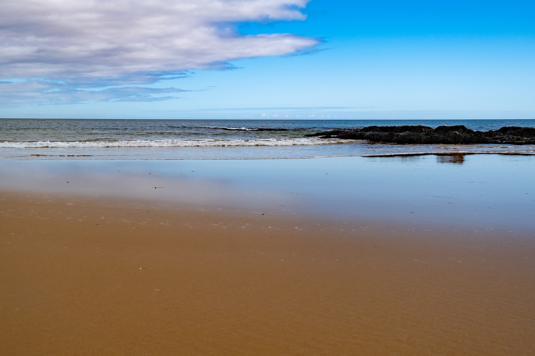 Tranquil Dornoch Beach sits behind the Royal Golf Hotel, one of the best beach hotels in Scotland