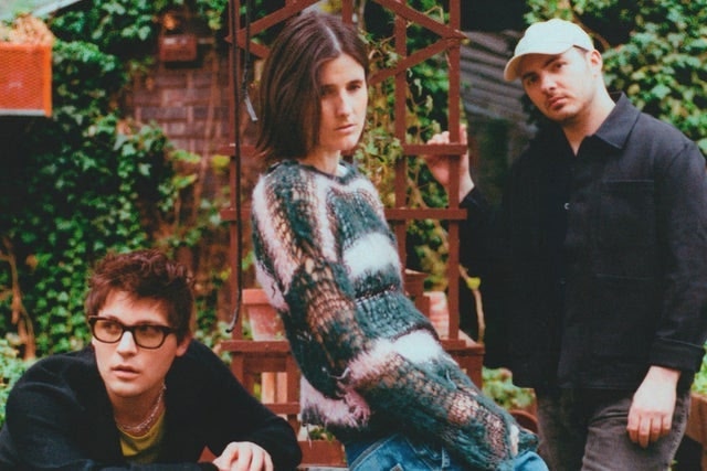 Members of the indie pop group Valley sitting down 