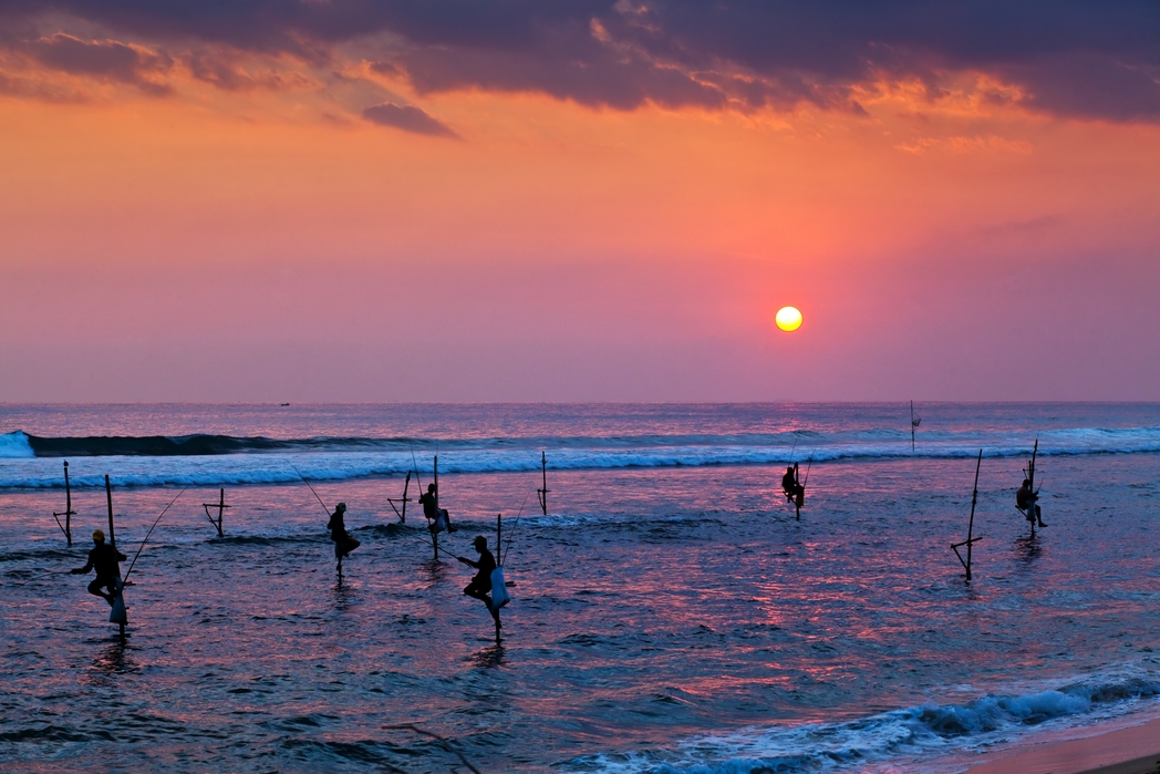 Fishermen in the sea at sunset - When is the Best Time to Visit Sri Lanka in 2020