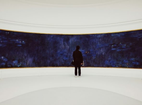 An image of a person admiring a piece of art.