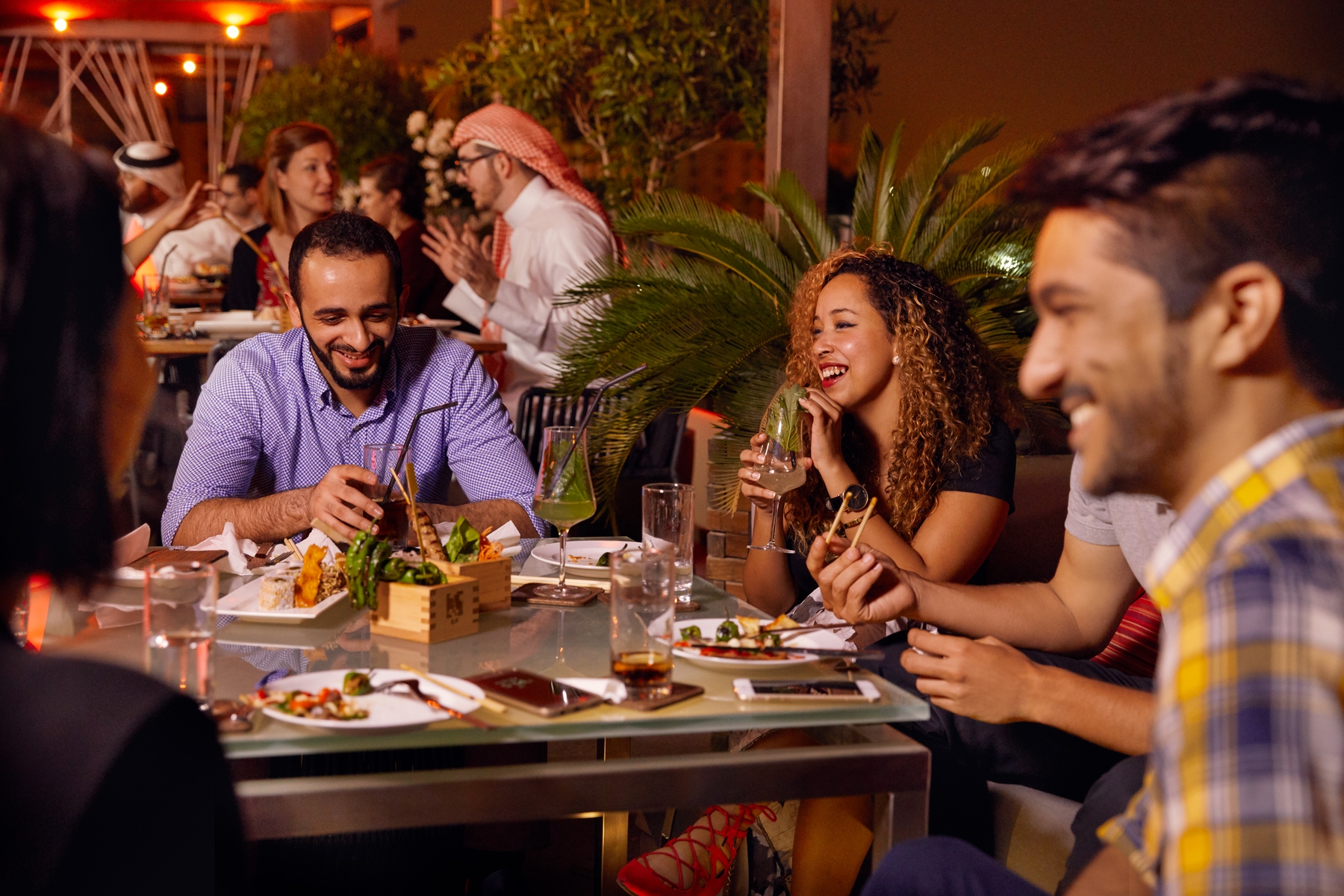 People dining at a lively restaurant in Bahrain