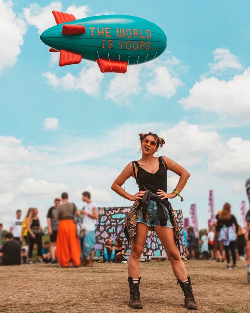 A woman standing with her hands on her hips at Parklife Festival, Manchester.