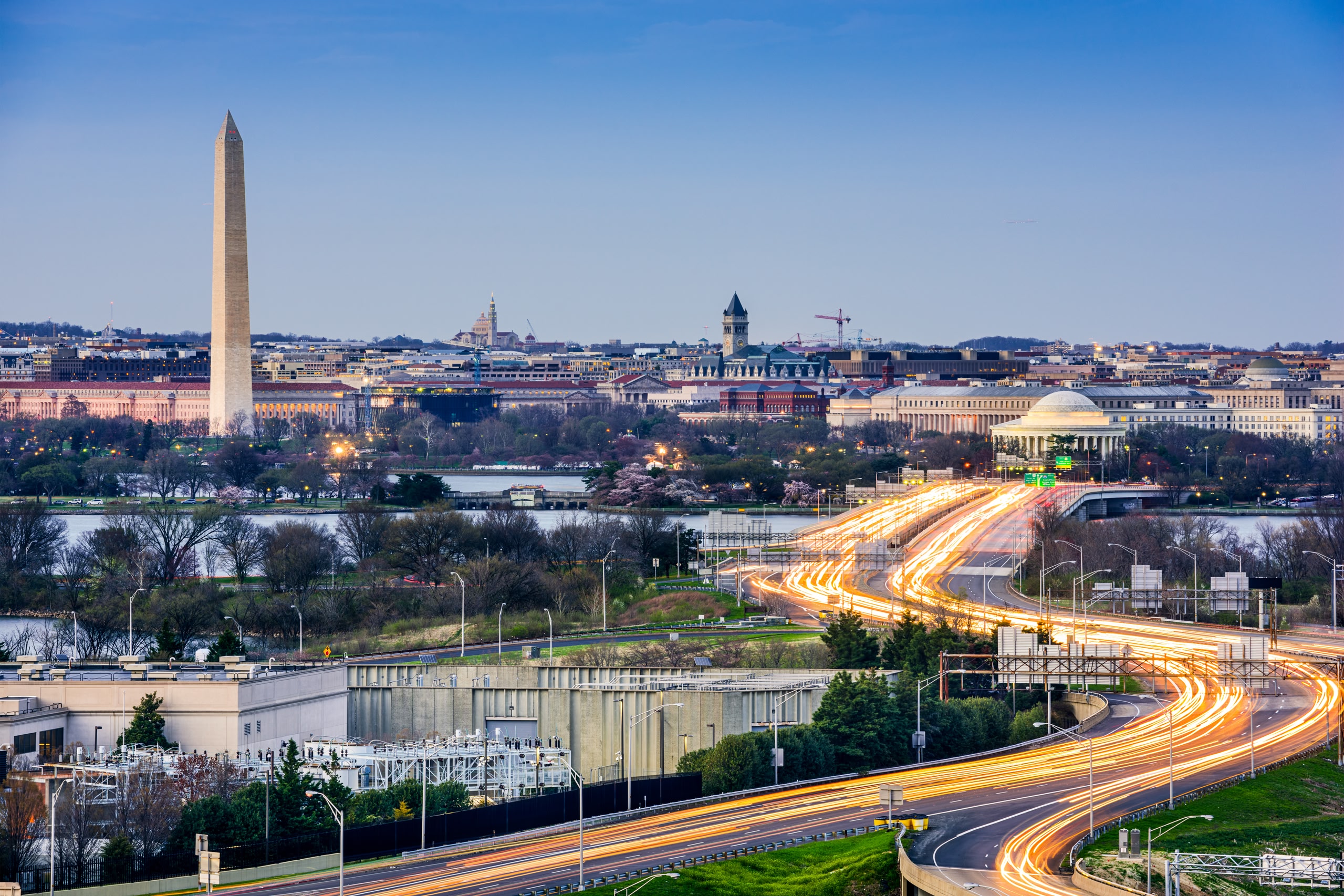 Washington DC cityscape. The roads are lit up artificially to mimic cars on the road. 