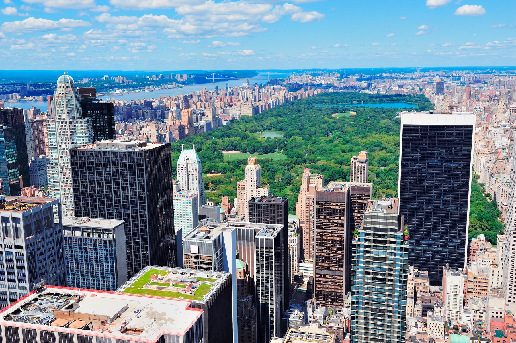 View of Central Park from above, surrounded by skyscrapers. Central Park in Manhattan