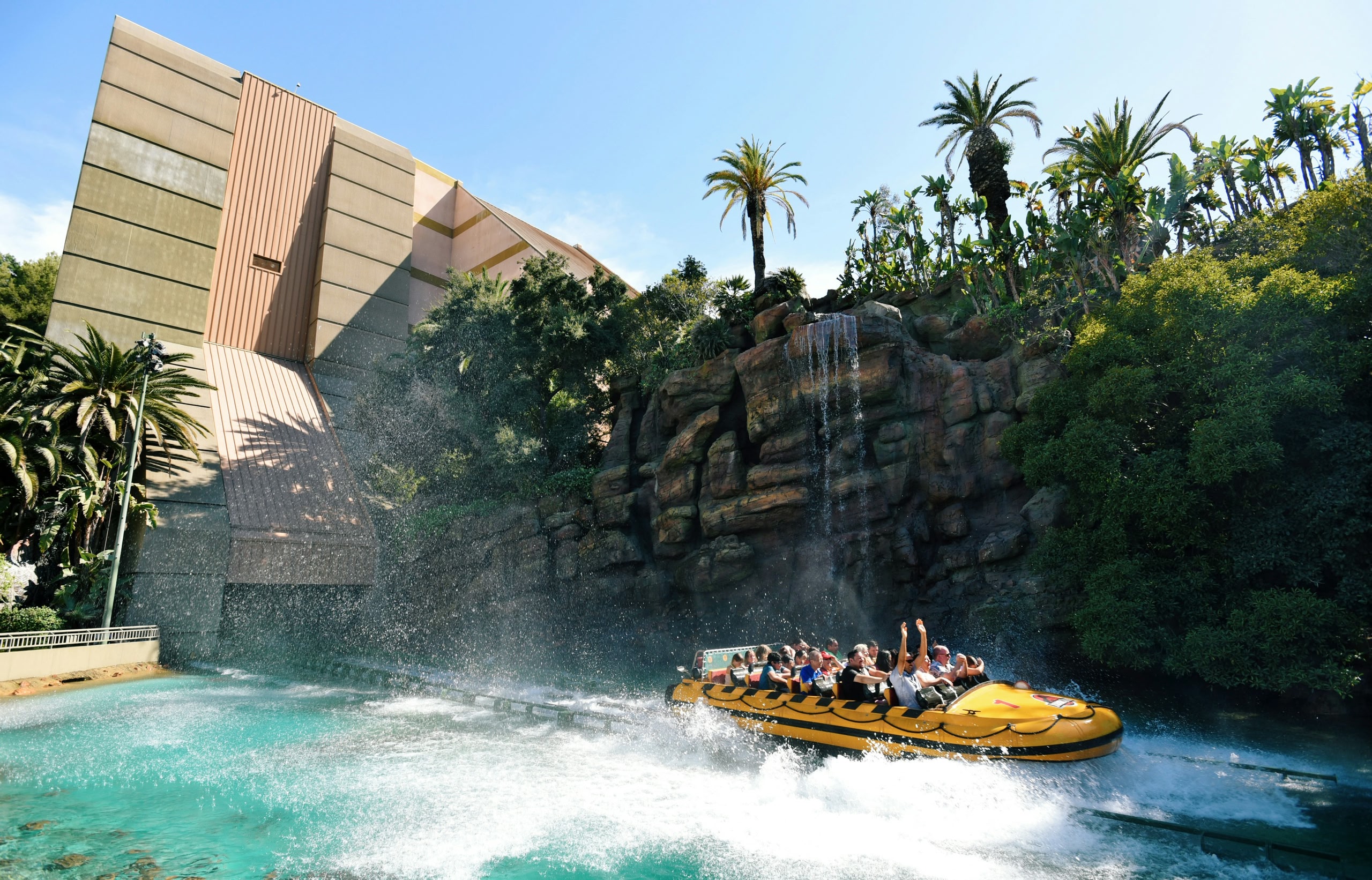 People on a water ride with their hands in the air at Universal Studios, Hollywood.