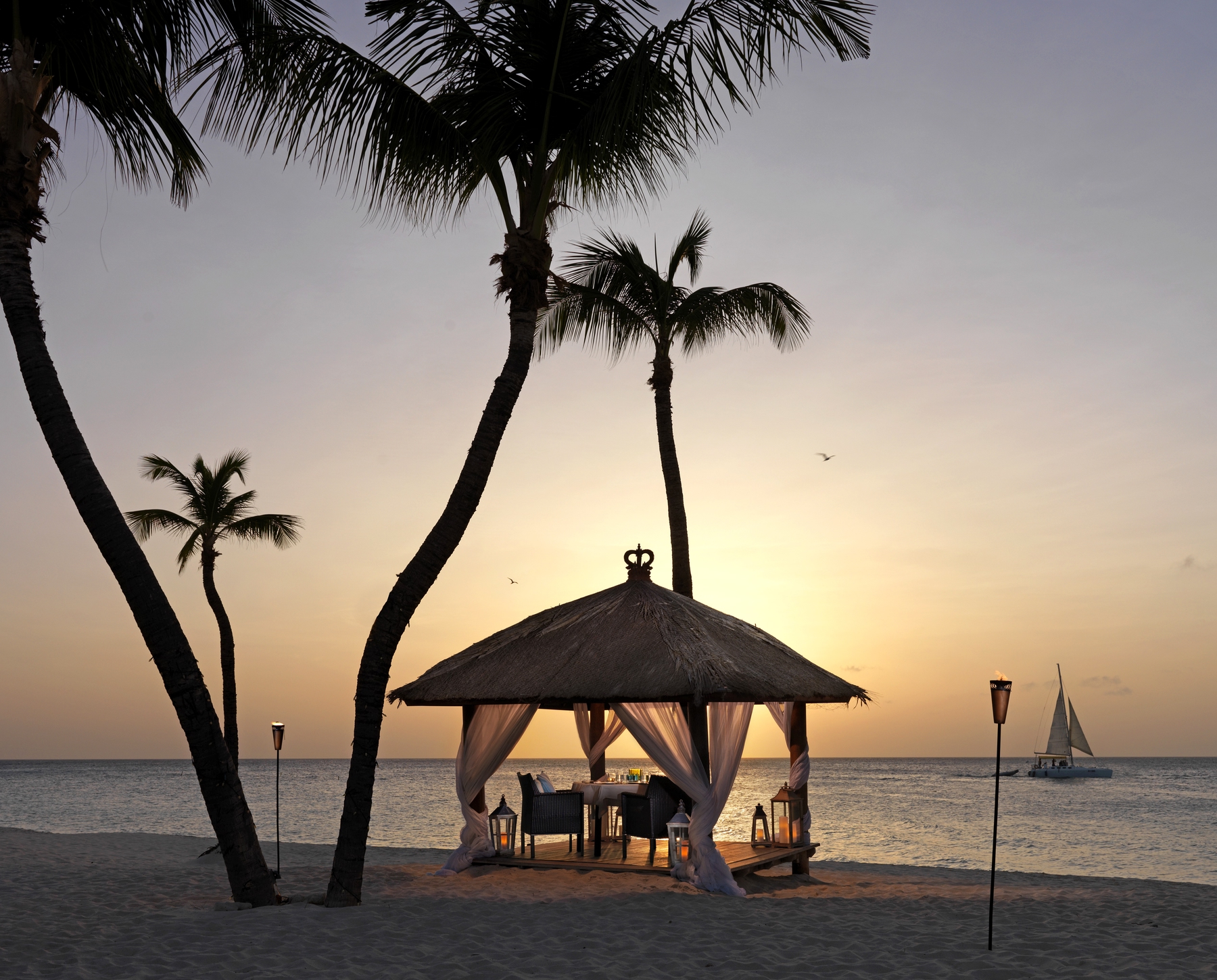 Aruba Tourism Authority private dining canopy at the beach by sunset