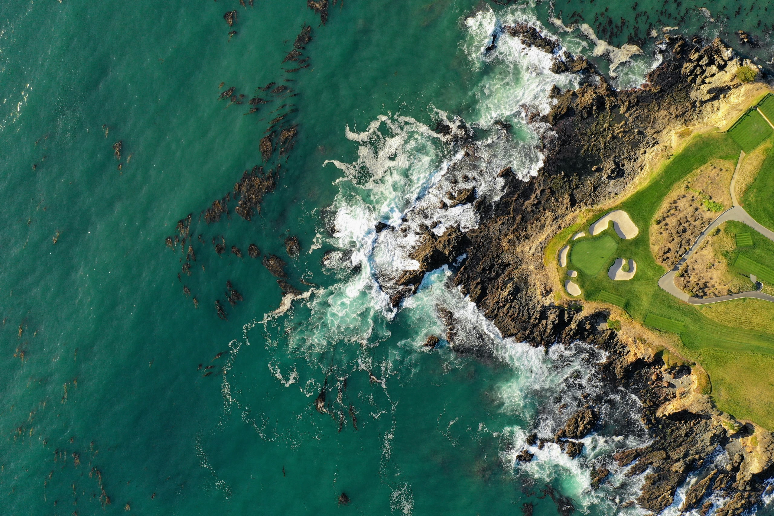 Aerial view of the water and golf course at Pebble Beach in California.