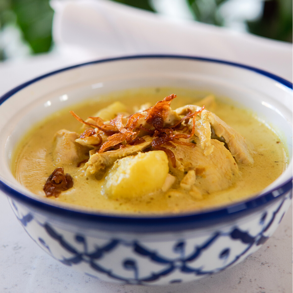 Bowl of yellow Thai Curry takeout food