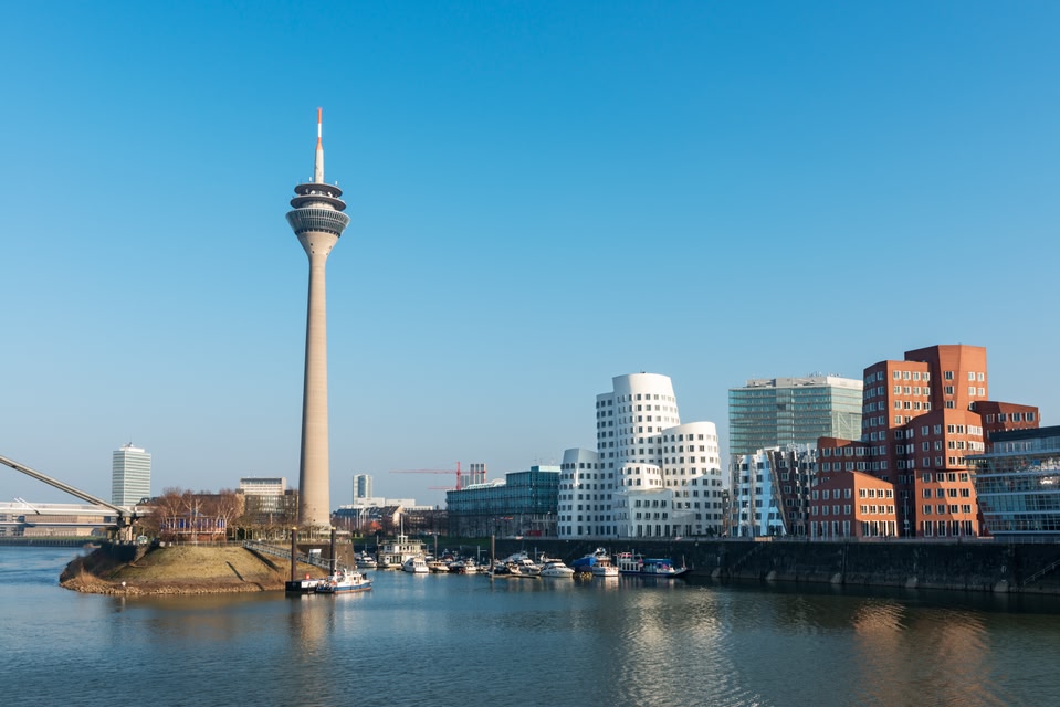 View of Dusseldorf harbour (Medienhafen) with modern buildings for media and communications activities and Rheinturm