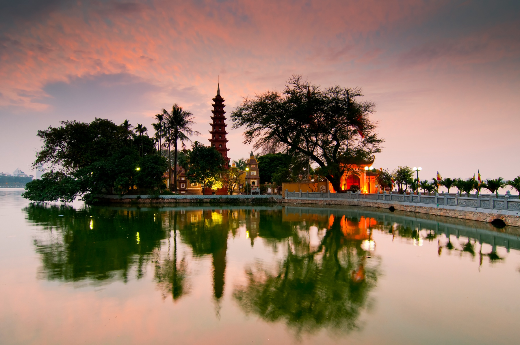 lake and pagoda by sunset in Hanoi, Vietnam.