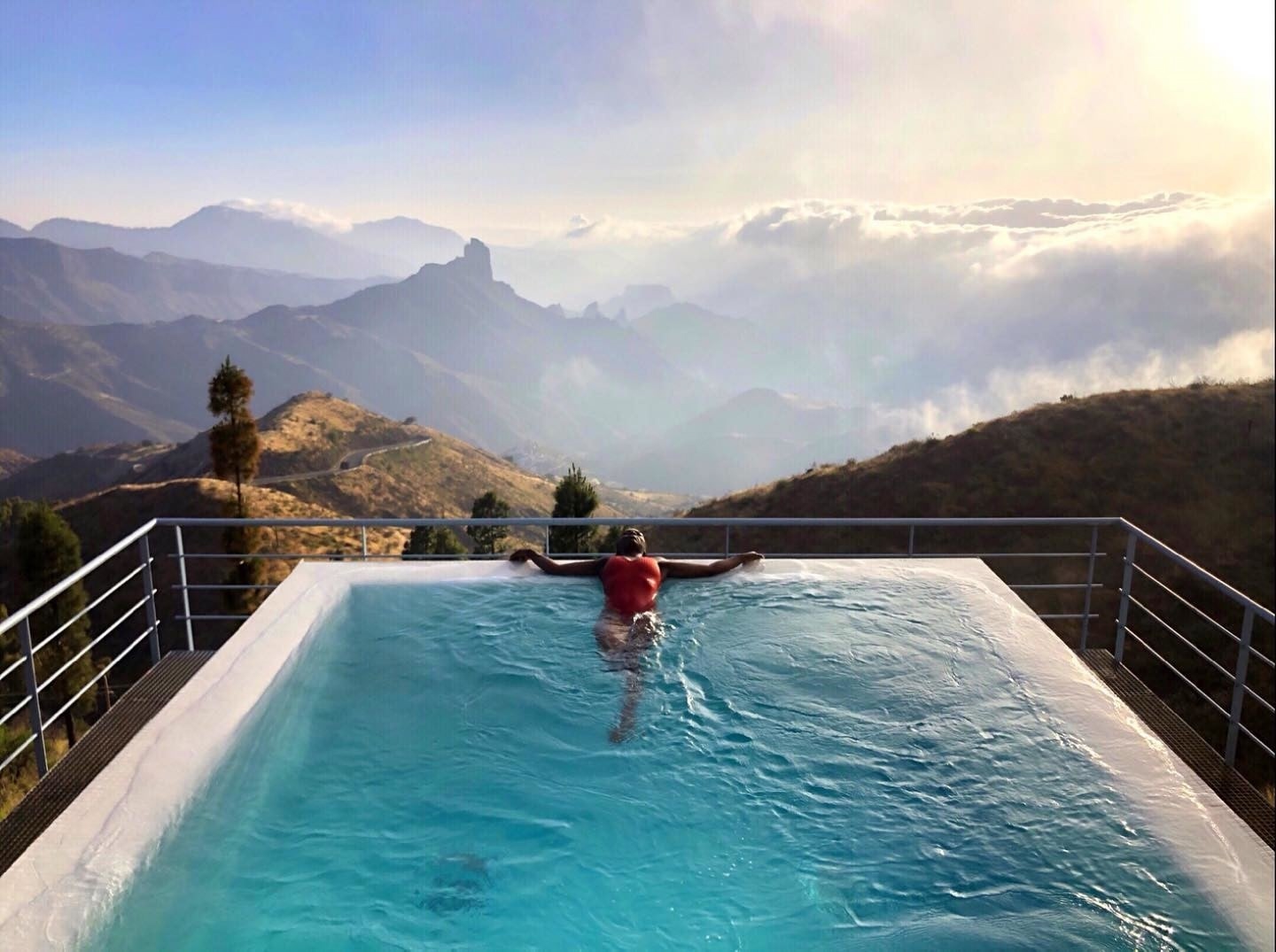 A female traveller in the pool in Gran Canaria, Spain, a perfect destination to escape Christmas